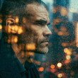 © Visual Studio - Urban Portrait of a Thoughtful Mature Businessman in a Rainy Cityscape