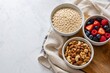 © 张 源远 - Overnight oats ingredients in ceramic bowls for commercial use