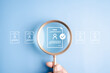 © Kiattisak - Human resources recruitment and hiring the right job candidate. Hand holding magnifying glass over resume document icon with checkmark for approval.