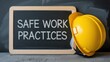 © Stock by Anika - Safe Work Practices message written on a chalkboard with a yellow hard hat, symbolizing workplace safety and protection.