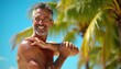 © miss irine - Smiling man applies sun cream to shoulder. Mature guy with grey hair on tropical beach. Healthy lifestyle, skincare routine, body care outdoors.