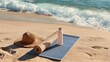 © Farah - A straw hat and a rolled yoga mat with a water bottle resting on the sand near the ocean waves