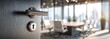 © Demma - A slightly ajar door reveals an office meeting room with a large wooden table and chairs, sunlight streaming through windows