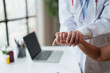 © Tj - Healthcare professional offering compassionate support and reassurance to a patient by gently holding hands, emphasizing care and trust in a medical setting