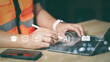 © wanniwat - Engineer in safety vest working on laptop with AI icons for e-learning, certification and industrial coaching. Modern vocational education and artificial intelligence integration in workplace.