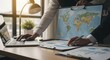 © Goh - Entrepreneurs collaborating and planning global business strategy with maps and data analysis at a modern office desk