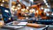 © Denis Yevtekhov - A laptop and notebook on a factory floor table with robotic arms automating electronics assembly in soft blur, diverse factory, electronics assembly, automatic conveyor, ai