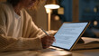 © forenna - Single spaced repetition flashcard app screen close up, a university student's stylus hovering over an anatomy term, dim dormitory desk lamp illuminating sticky notes and a open physiology textbook