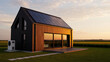 © Sadiya Digital - Modern black and wood house with solar panels at golden hour real estate heat pump architecture