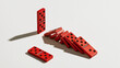 © Aillusionist - Upright red domino resisting chain reaction among fallen dominoes resilience leadership risk management and business disruption concept