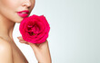 © Oleg Gekman - Beautiful model with a rose. Perfect woman face makeup close up. Lipstick. Beautiful nails. Nice smile. Perfect skin