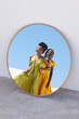 © peopleimages.com - Fashion, mirror and black women outdoor with trendy clothes, modern style and elegant outfit. Confidence, beauty and African people with designer accessories, cosmetics and makeup in reflection
