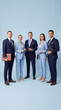 © machaon - Stylish business executives standing together in blue corporate suits