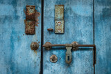 Close up photo of old wooden door with a door latch