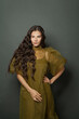 © millaf (Nemchinova) - Studio portrait of long hair woman, classic hairs curly. Brunette model with wavy hair looking at camera