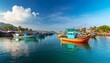 © Alan - colorful wooden fishing boats line a narrow harbor channel with tropical waterfront village on phu quoc island vietnam traditional fishing industry in asia sustainable local food supply