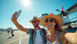 © Viktor - Couple takes selfie with airplane on tarmac. Happy pair smiles with excitement for journey. They wear hats and sunglasses, ready for vacation fun.