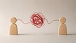 © Ahmed - Two wooden figures connected by a messy, tangled red string. Concept of miscommunication, relationship conflict, complex negotiation, or difficult business partnerships requiring resolution.