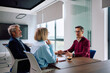 © Drazen - Male candidate talking to human resource managers during job interview in office.