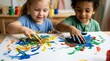 © Kristina - Group of children painting on a large sheet of paper with their hands. Kids engaged in a creative art project in a classroom. Early childhood development and educational activity.