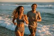 © whitestorm - Joyful couple running on a beach at sunset, enjoying a healthy lifestyle and outdoor activity together.
