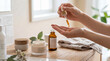 © Stephen - Hands applying natural essential oil serum from a dropper bottle into palm, part of a luxurious beauty routine.