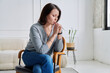© Valerii Honcharuk - Depressed worried mature woman sitting on a chair, at home