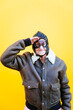 © oneinchpunch - Funny portraits with old grandmother. Senior woman acting as an aviator from the first world war