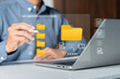 © iqbal - Businessman organizing digital folders and files on a virtual computer interface. Data categorization, digital asset management, administrative efficiency, and structured filing systems