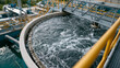 © pattozher - Water Treatment Process: A view of industrial water treatment, showcasing a pivotal step in the purification process, focusing on the infrastructure and technology essential for ensuring clean water.