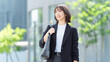 © Trickster* - オフィス街を歩く女性・ビジネスウーマン, Businesswoman Walking in an Office District