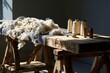 © Fiora - Raw sheep wool and vintage thread spools on a rustic wooden workbench with dramatic side lighting for textile and sustainable fashion branding