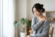 © maaagram - 肩こりや首の痛みに悩む辛そうな表情の日本人女性 Generative AI