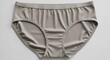 © ArchieFlowStudio - Soft Taupe Women's Underwear Briefs, Everyday Comfort Lingerie Laid Flat on White Background