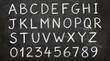 © Fauzan Adzima - White chalk letters and numbers handdrawn in a sansserif font on a black chalkboard background