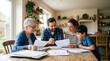 © Mr. Bolota - Family reviewing documents together at a kitchen table