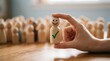 © Galuh - Concept of selecting happy wooden figure with checkmark among blurred crowd of figures