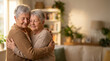 © Yulia - Elderly lesbian couple warmly hugging in cozy living room with soft natural light and blurred background