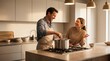 © haris - A happy couple laughing while cooking together in a modern, well-lit kitchen, preparing a meal on the stovetop.