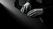 © Yuliia - Professional businessman hands on dark desk with smartphone in dramatic black and white lighting for corporate business concepts and office workspace designs.