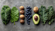 © HansAdam - Healthy superfood arrangement with kale spinach walnuts blueberries avocado on a grey background, flat lay