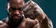 © Khawla - Dynamic Fist Impact with Dust. close up of a strong fist of a black person
