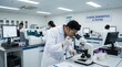 © Sonthana - Scientists in a clinical diagnostics lab conducting tests using microscopes and advanced laboratory equipment.