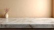 © Bussakon - A delicate vase with pink flowers rests on a polished marble surface against a soft warm gradient background