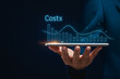 © Mitha - Businessman Holding Tablet with Floating Financial Cost Reduction Graph and Data Analytics Chart