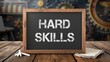 © VolumeThings - Chalkboard displaying Hard Skills against a wooden backdrop