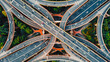 © Danko Creative - Aerial top view of complex highway interchange with traffic in modern Chinese city