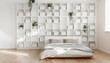 © Super Abi - Modern Minimalist Bedroom Featuring a Large White Grid Shelving Unit with Storage Boxes and Green Plants, Bright Airy Contemporary Home Interior with Natural Sunlight on Wooden Floor