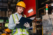 © Quality Stock Arts - Professional Engineer female worker supervisor Reading in heavy industry metal factory with safety