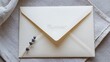 © romio - Elegant wedding invitation envelope with lavender flower on soft fabric background